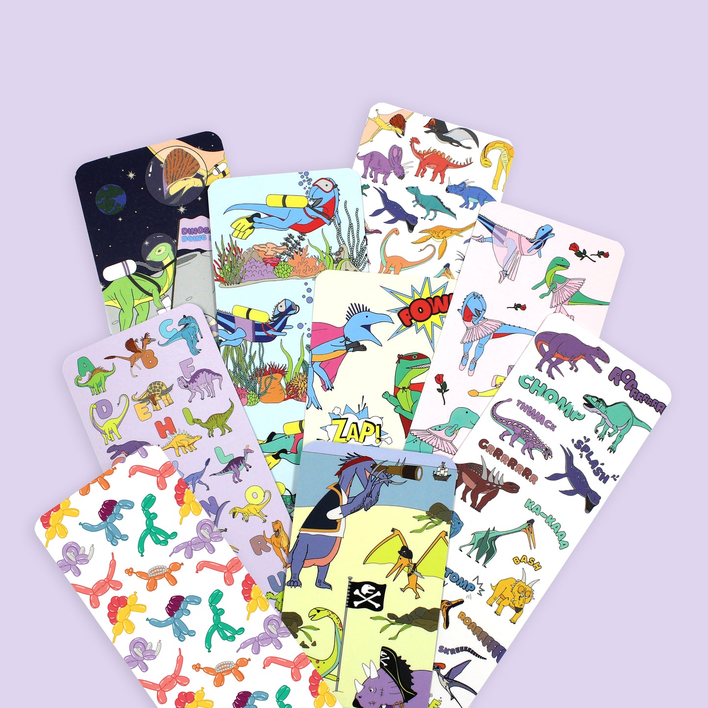 dinosaur bookmarks fanned out on a purple background