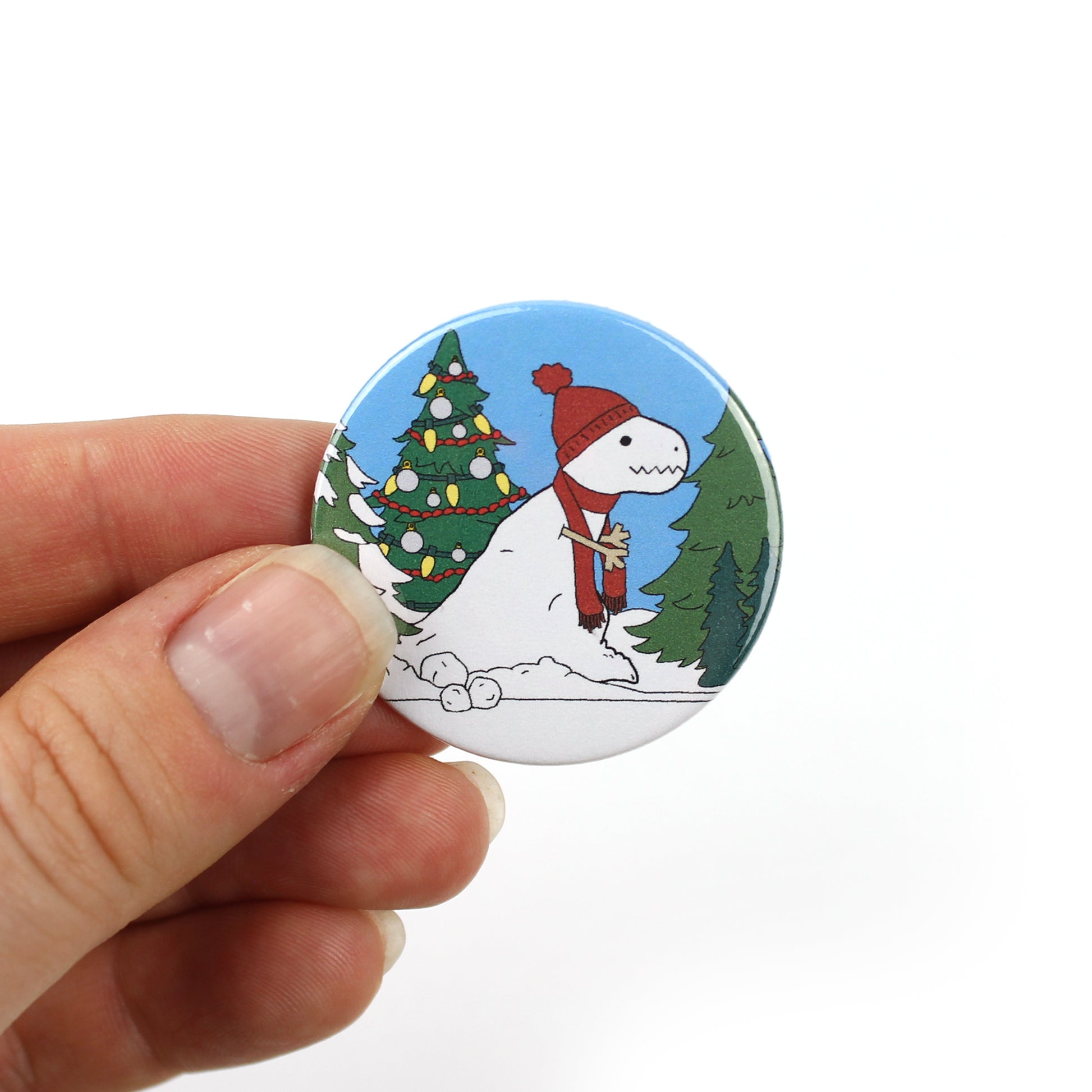 mini sbow-rex badge being held in finget tips