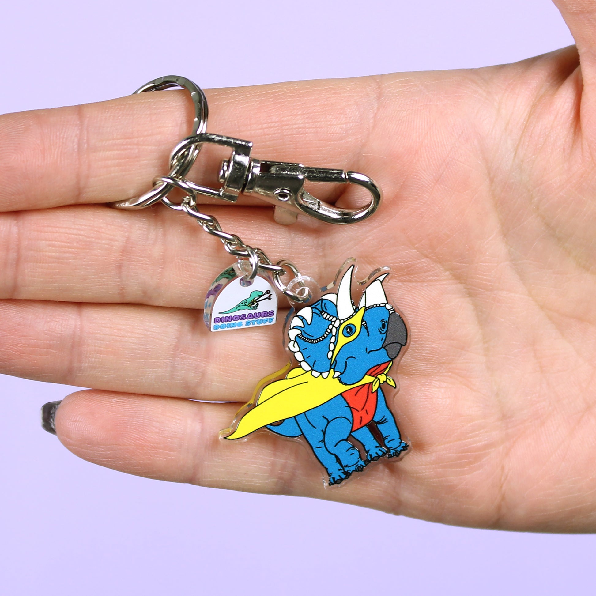 Superhero Dinosaur Keyring on a hand