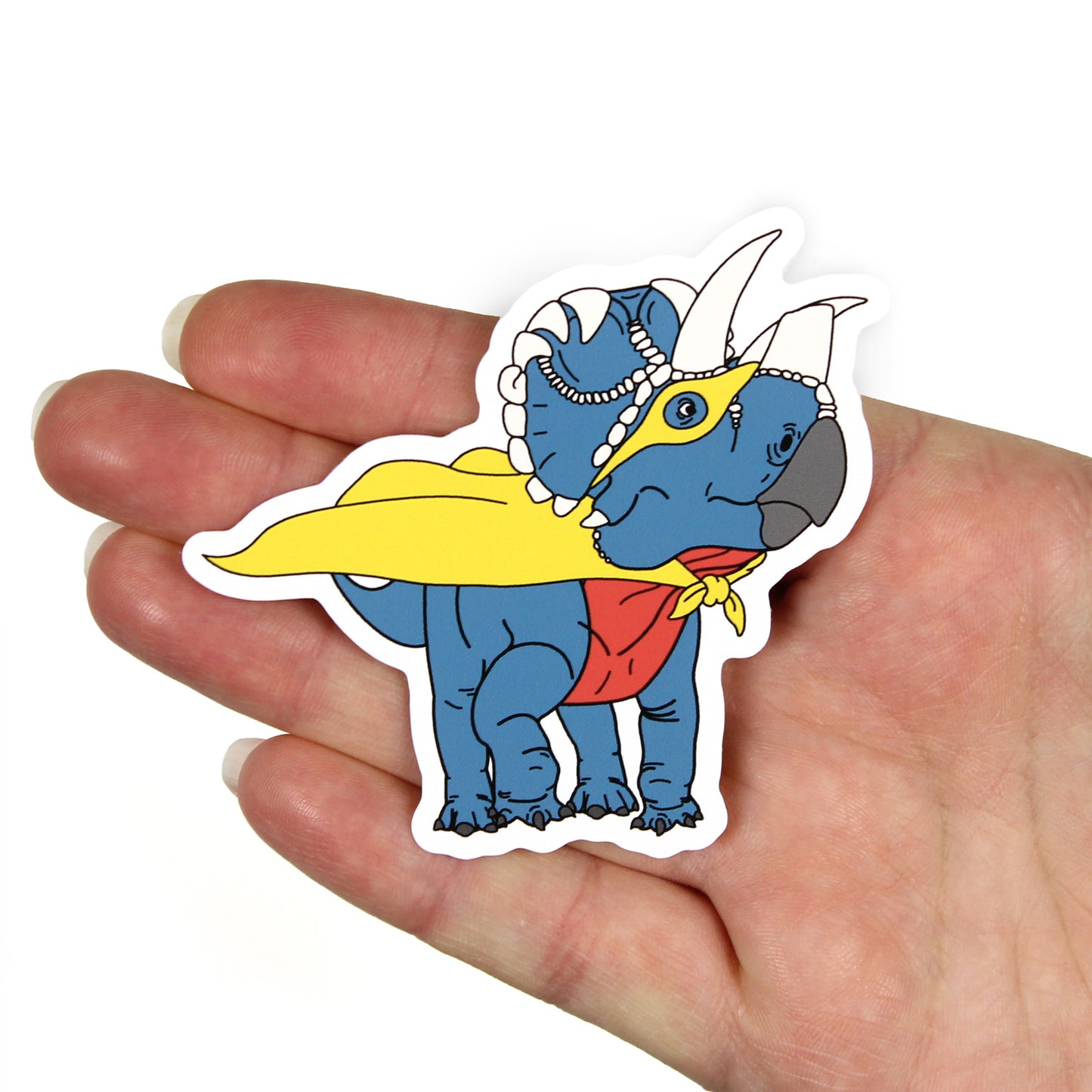 superhero dinosaur sticker on a hand with a white background