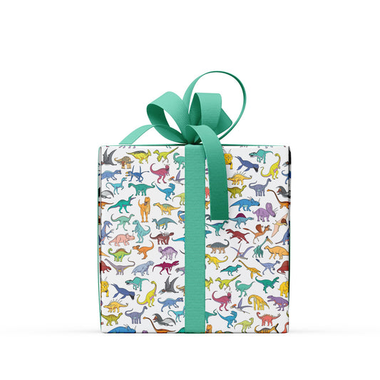 box covered in scatter dinosaur wrapping paper with a green bow