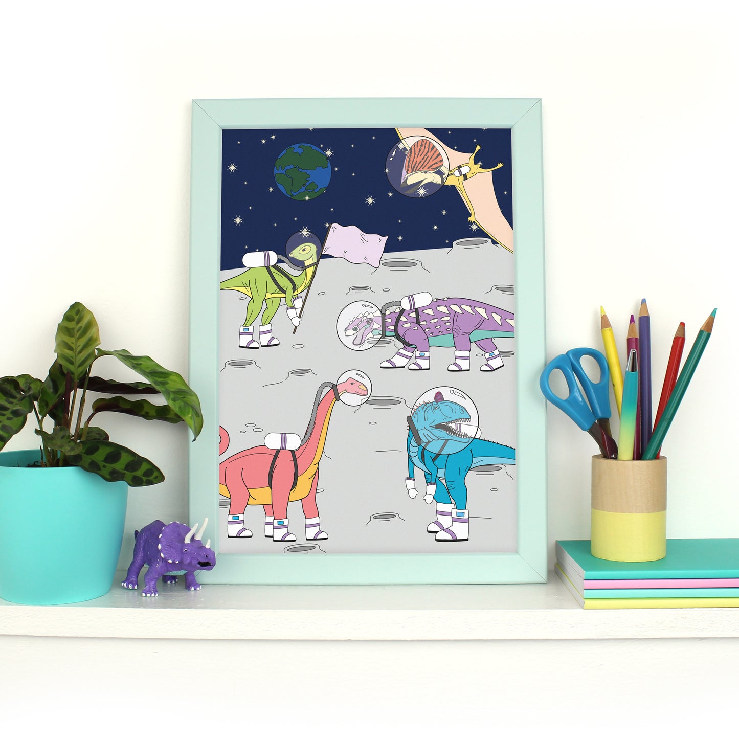 dinosaur space print in mint frame