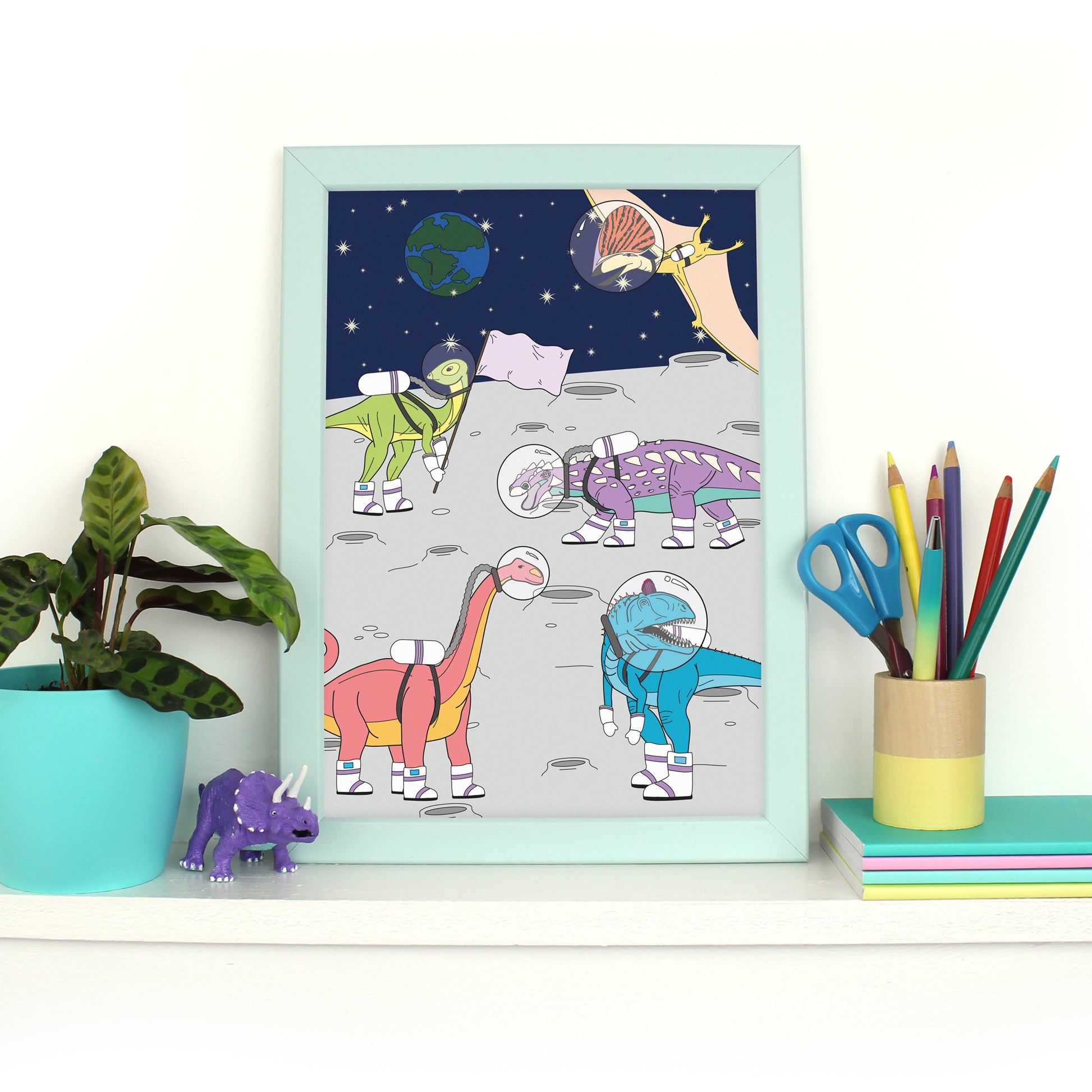 dinosaur space print in mint frame