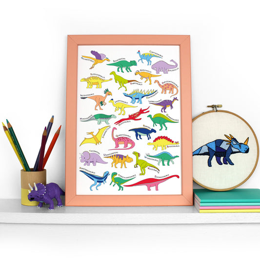 Dinosaur Alphabet Poster Print in a peach frame