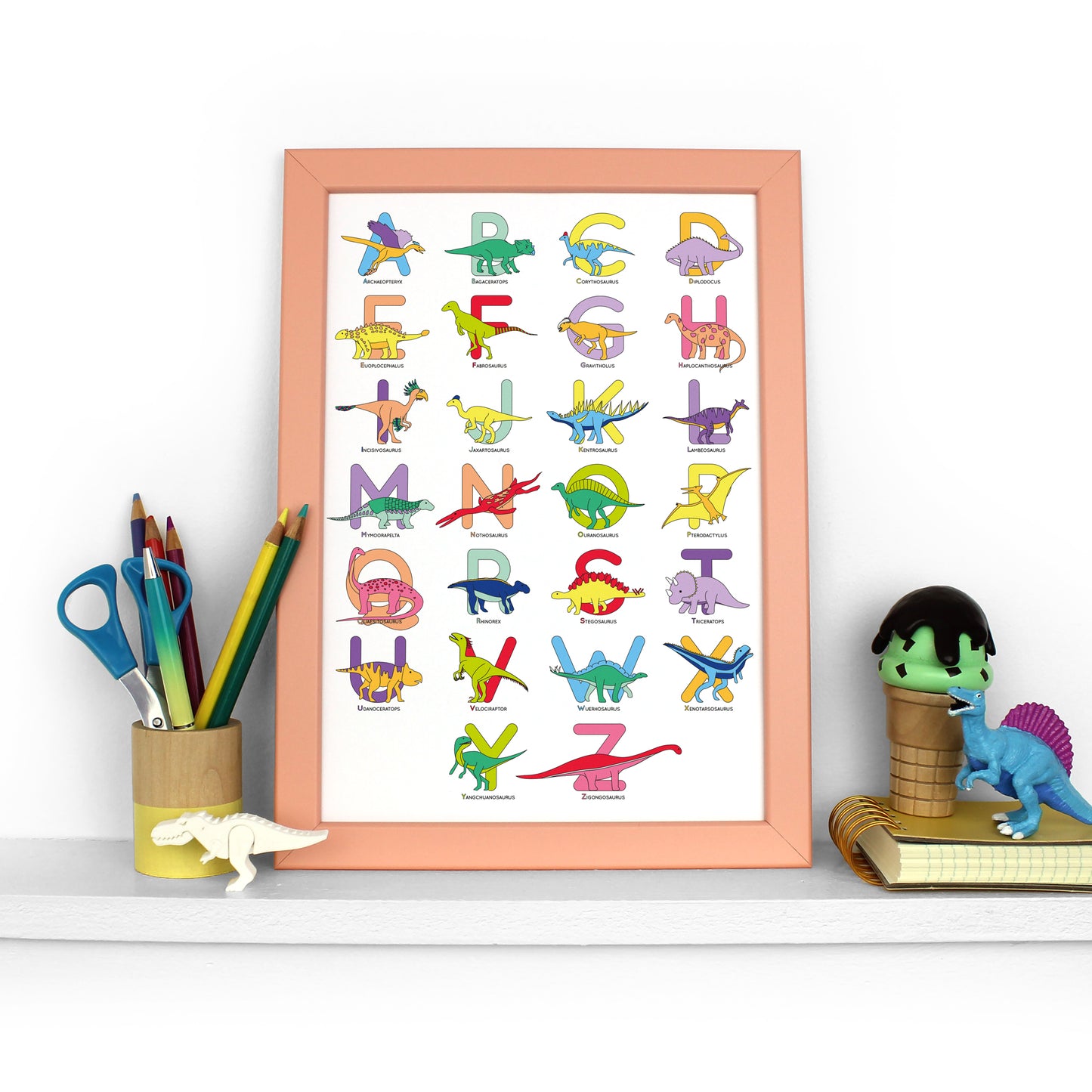 Large Letter Dinosaur Alphabet Poster Print in a peach frame