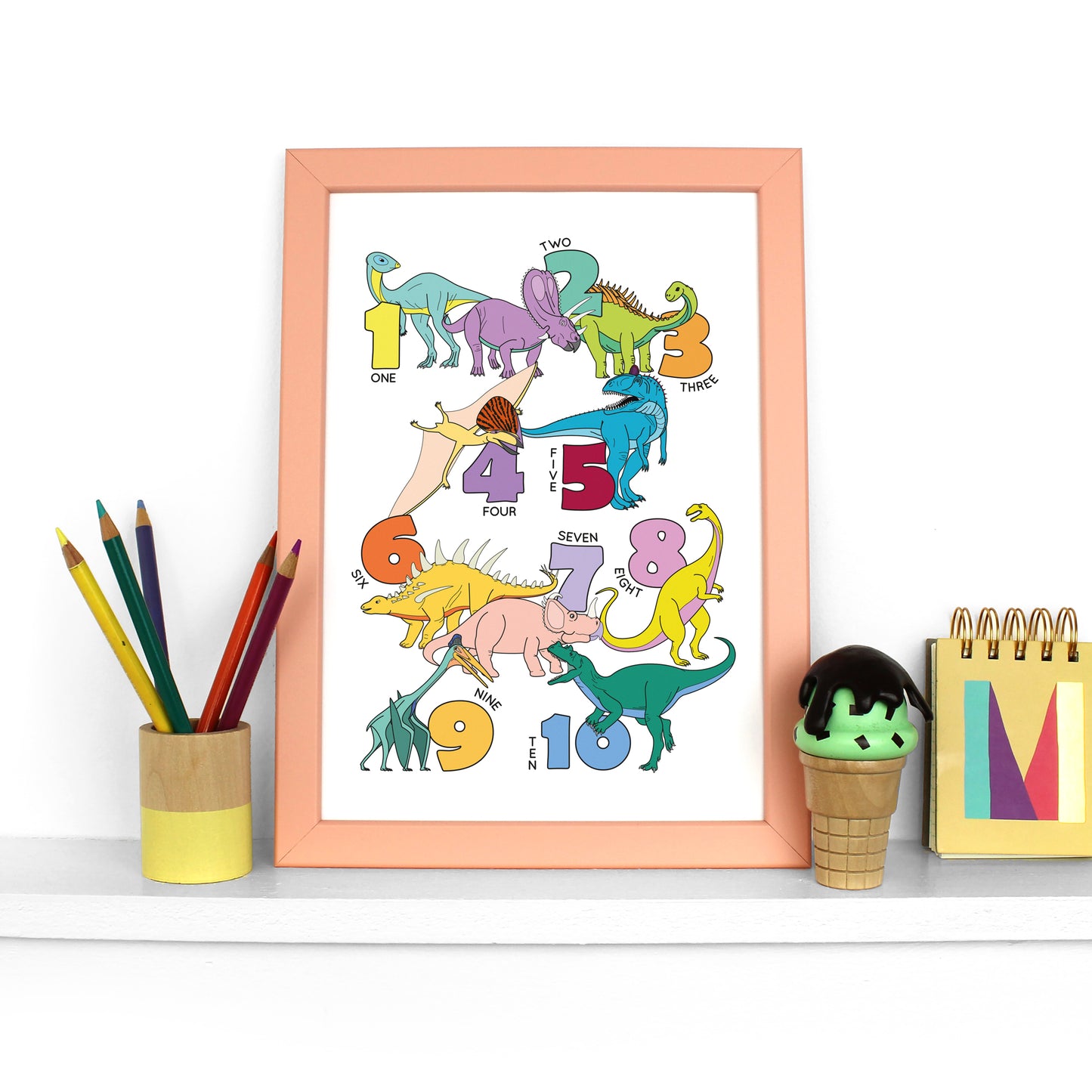 dinosaur number poster print in a peach frame