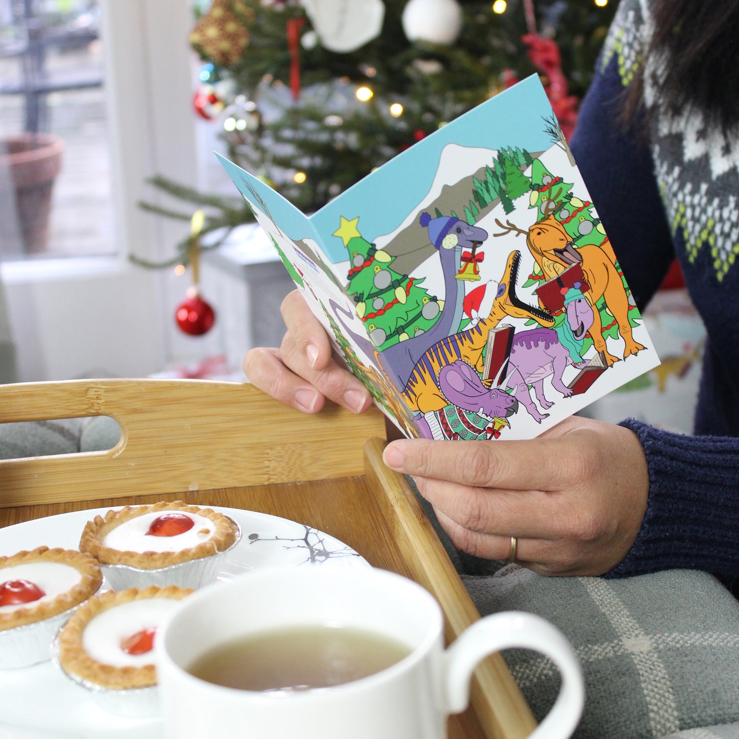 hands holding a christmas Winter Scene Greeting Card