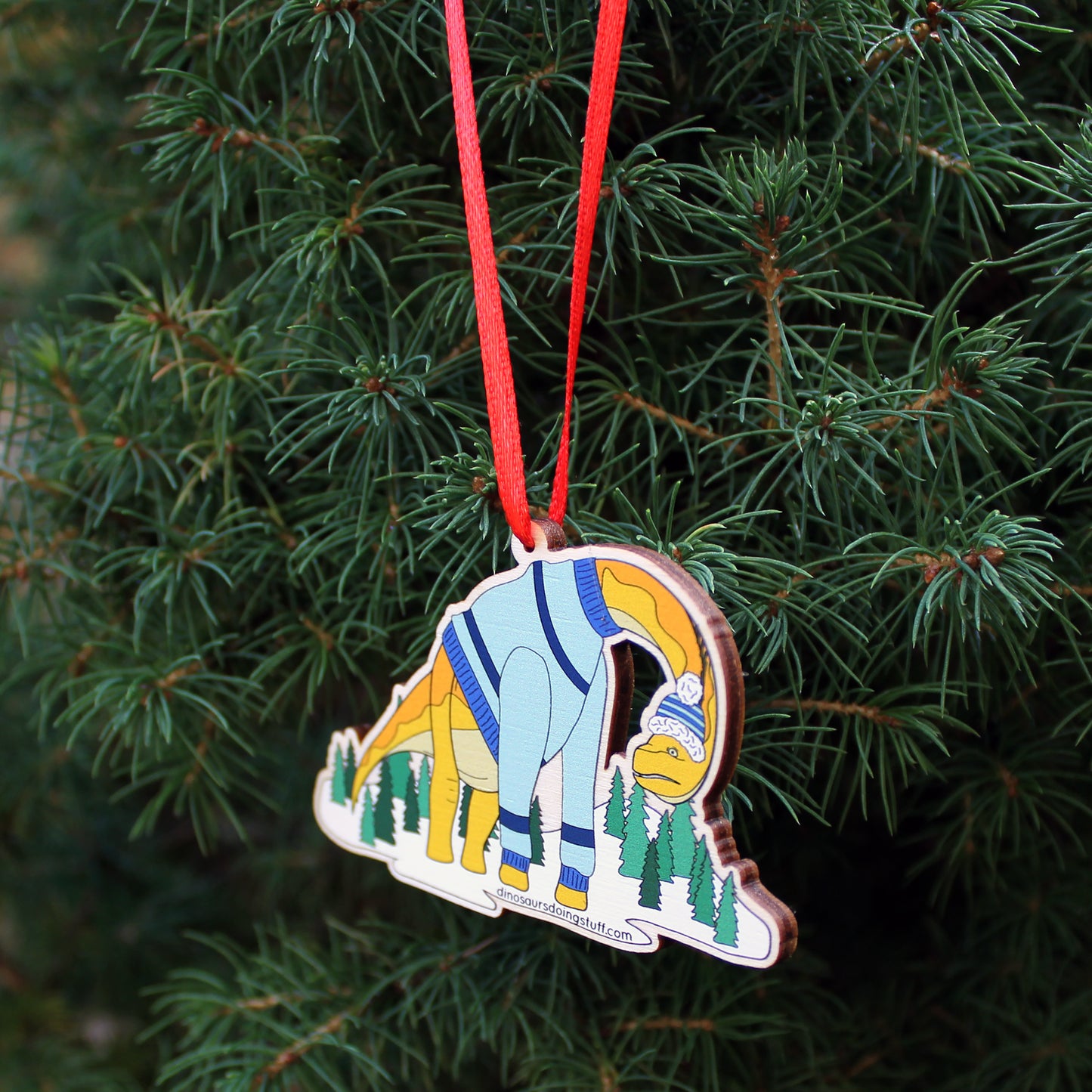 wooden ugly Christmas jumper decoration hanging on a Christmas tree