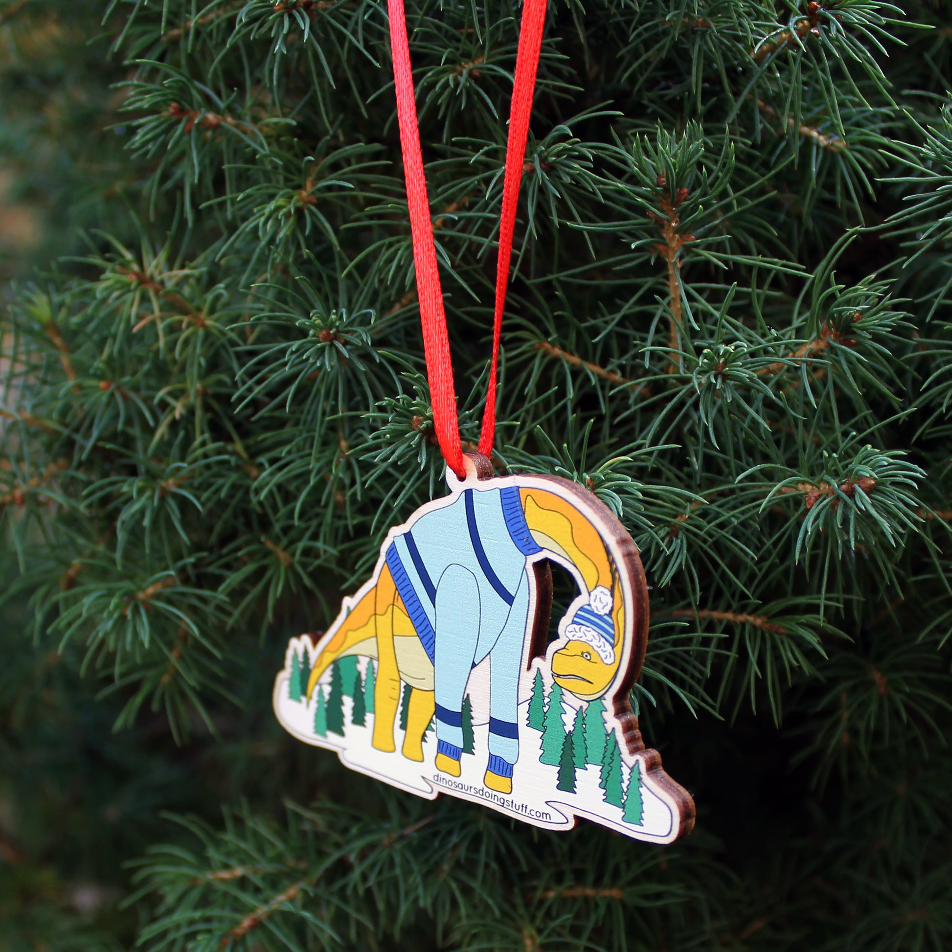 wooden ugly Christmas jumper decoration hanging on a Christmas tree