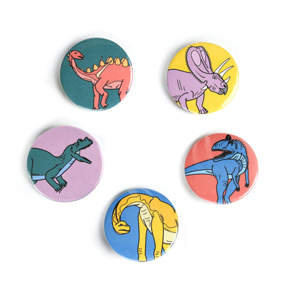5 mini dinosaur badges in a circle on  white background