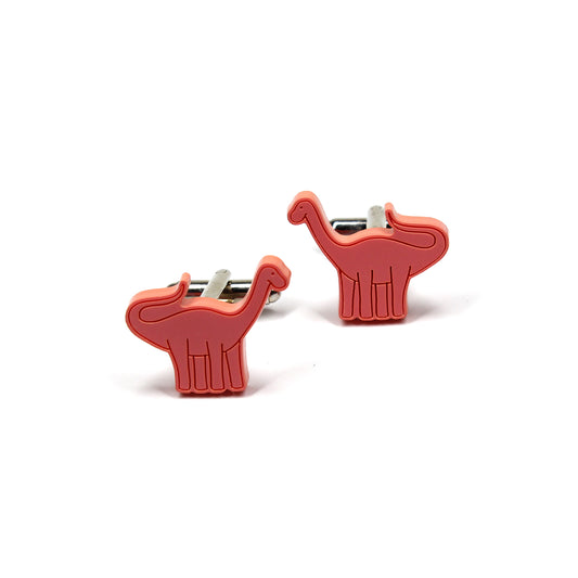 a pair of red brontosaurus dinosaur cufflinks on a white background