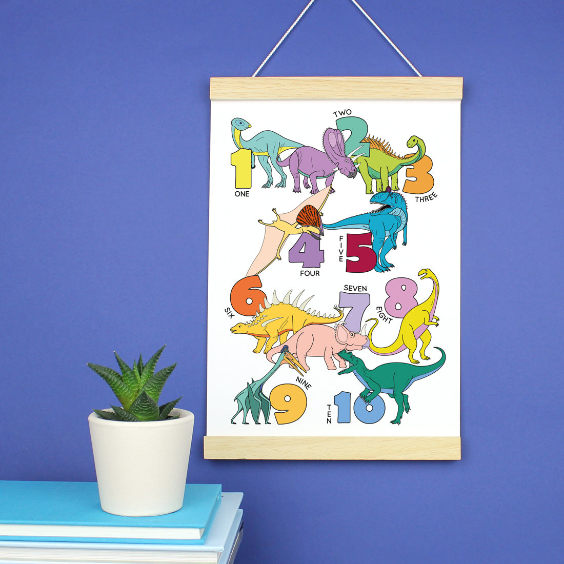 dinosaur number poster print in a wooden strip frame