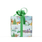 box wrapped in Christmas Winter Scene Dinosaur Wrapping Paper with a green ribbon