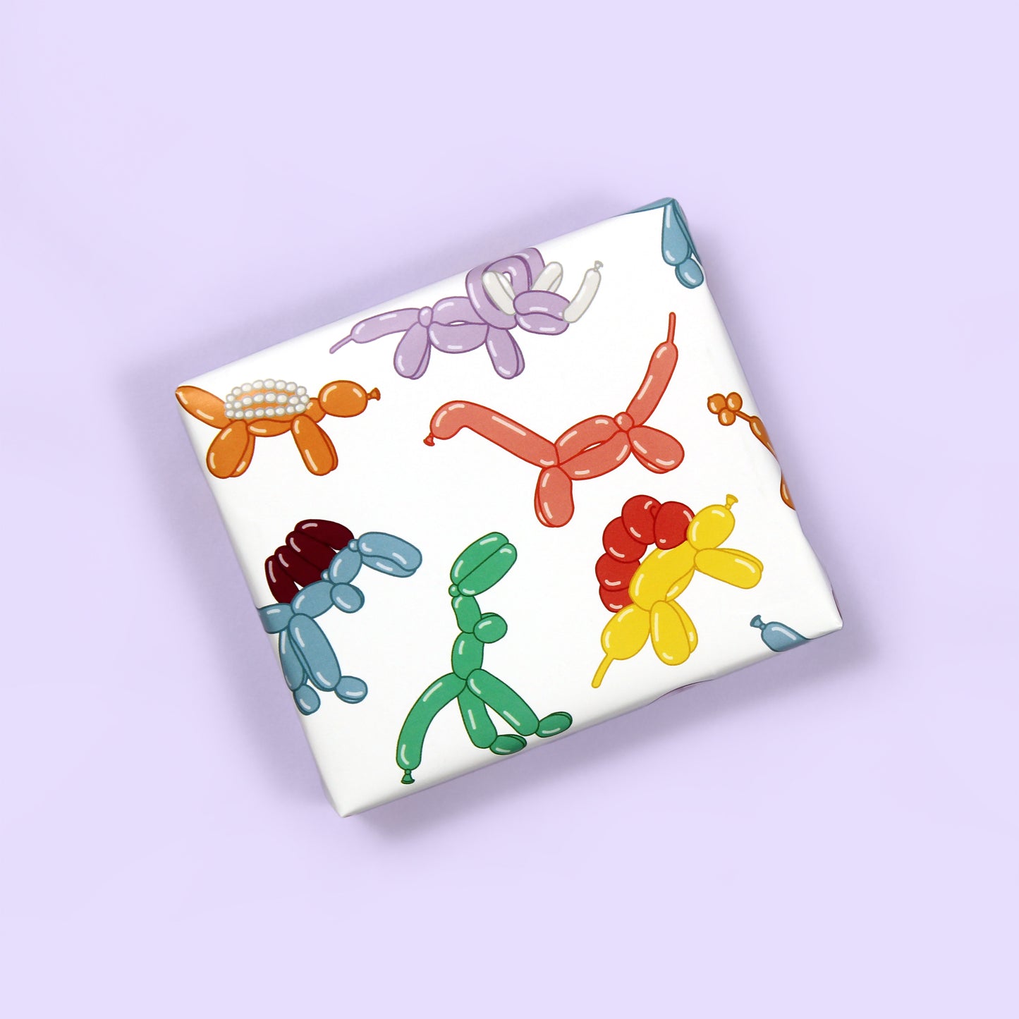 a small box wrapped in balloon animal Dinosaur Wrapping Paper