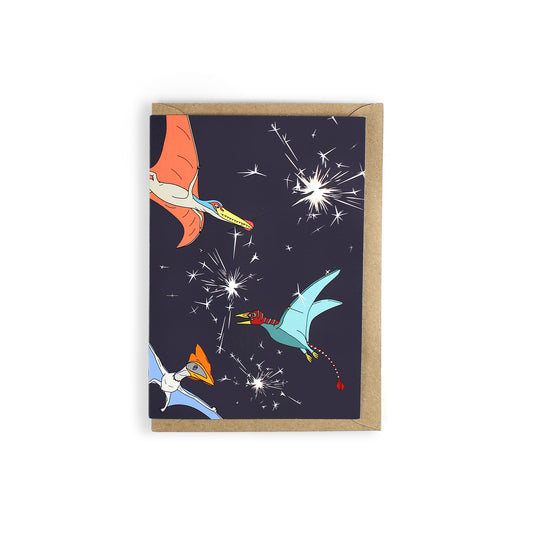 The card features three pterosaurs (flying reptiles), Liaoningopterus, Eudimorphodon and Thalassodromeus. They are holding sparklers in their mouths and flying on a very dark blue background.