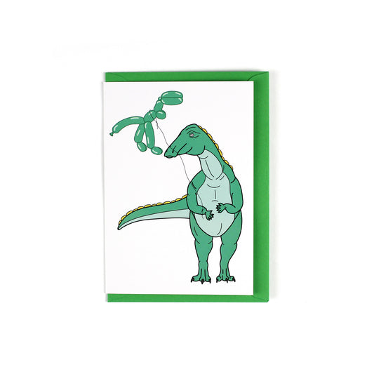 greeting card featuring a theropod dinosaur holding a balloon dinosaur on a string