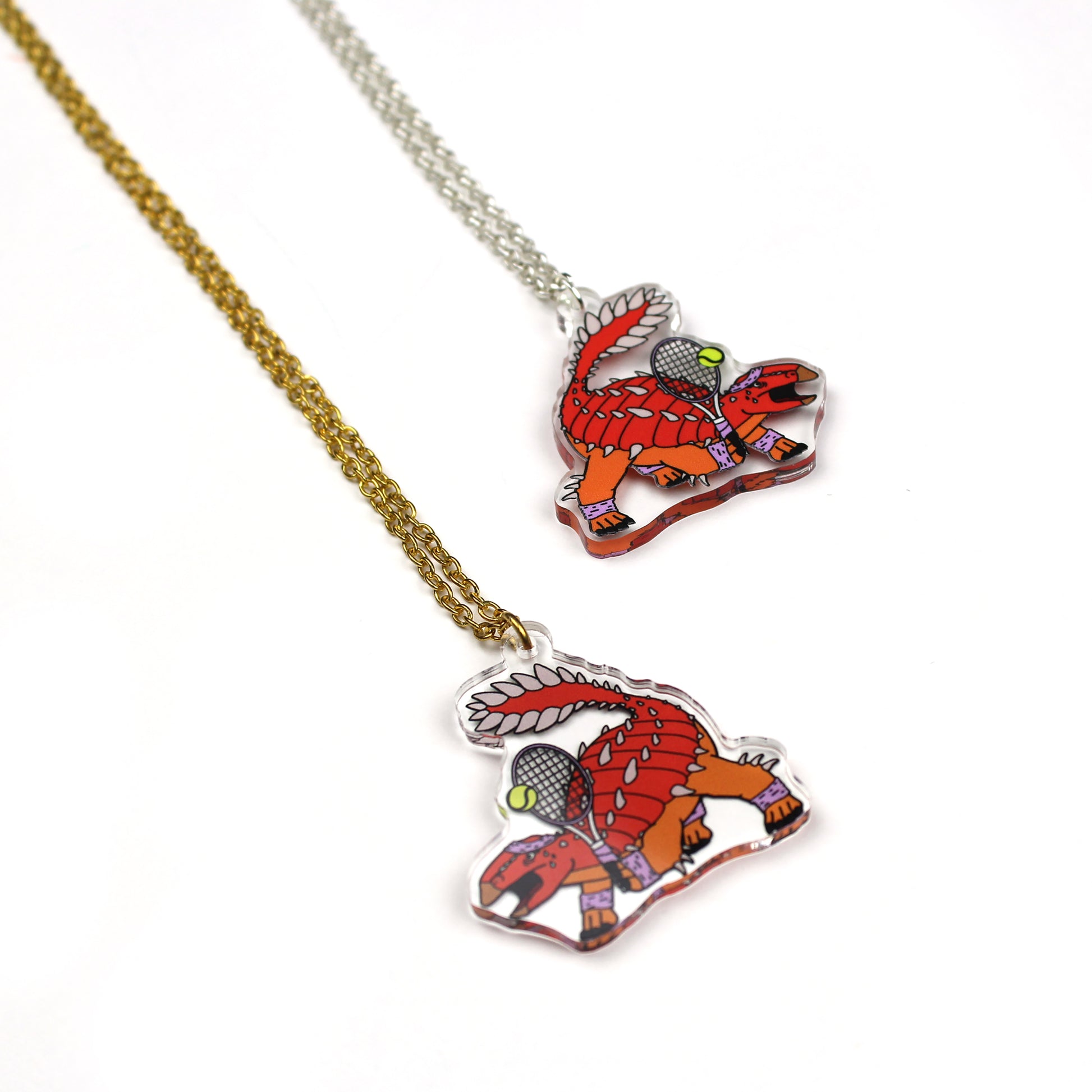 Tennis Dinosaur Necklace with gold and silver tone chain
