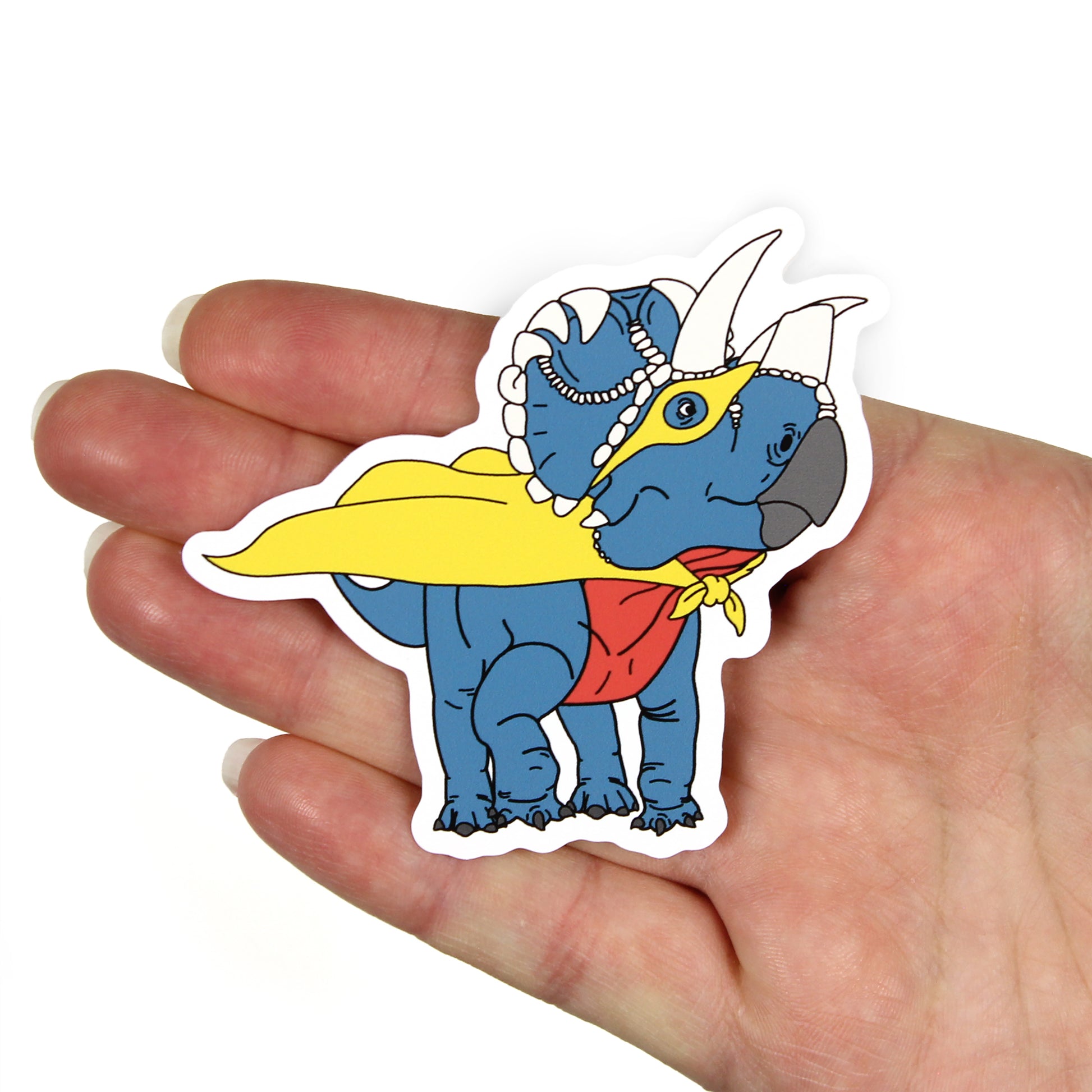 superhero  dinosaur sticker on a hand with a white background