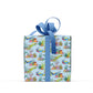 box covered in under the sea dinosaur wrapping paper with a blue bow