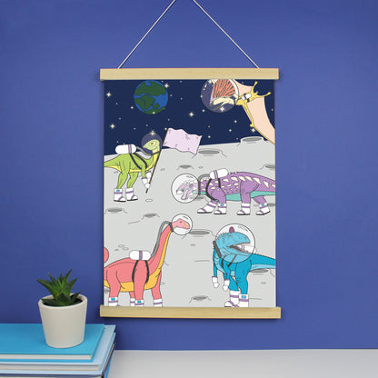 dinosaur space print in a light wood magnetic strip frame