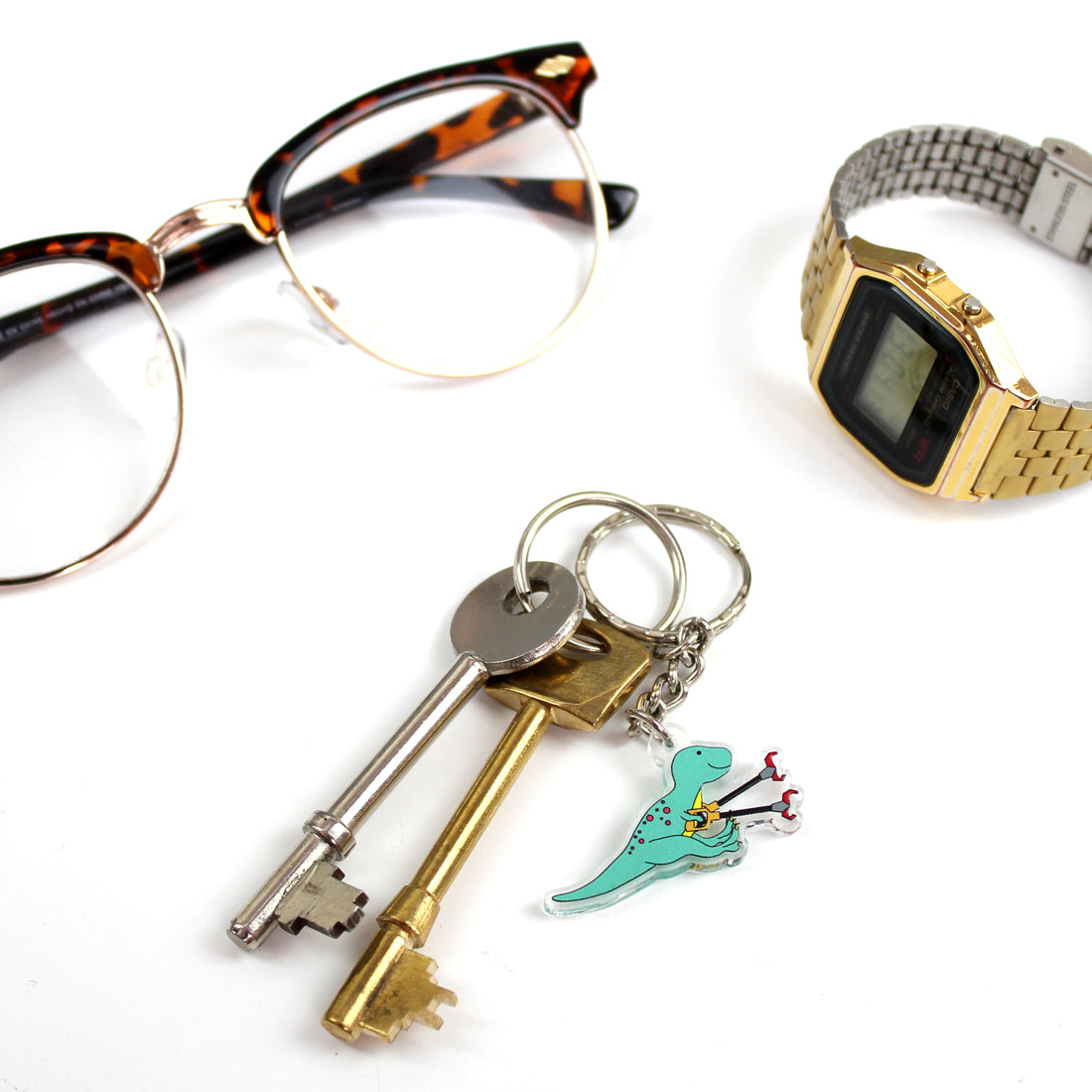 grabby arms t-rex dinosaur keyring on a split ring with keys and a watch and a pair of glasses