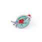 a Santa Claws acrylic pin on a white background