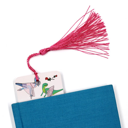 ballet dinosaur bookmark with a pink tassel coming out of a blue book