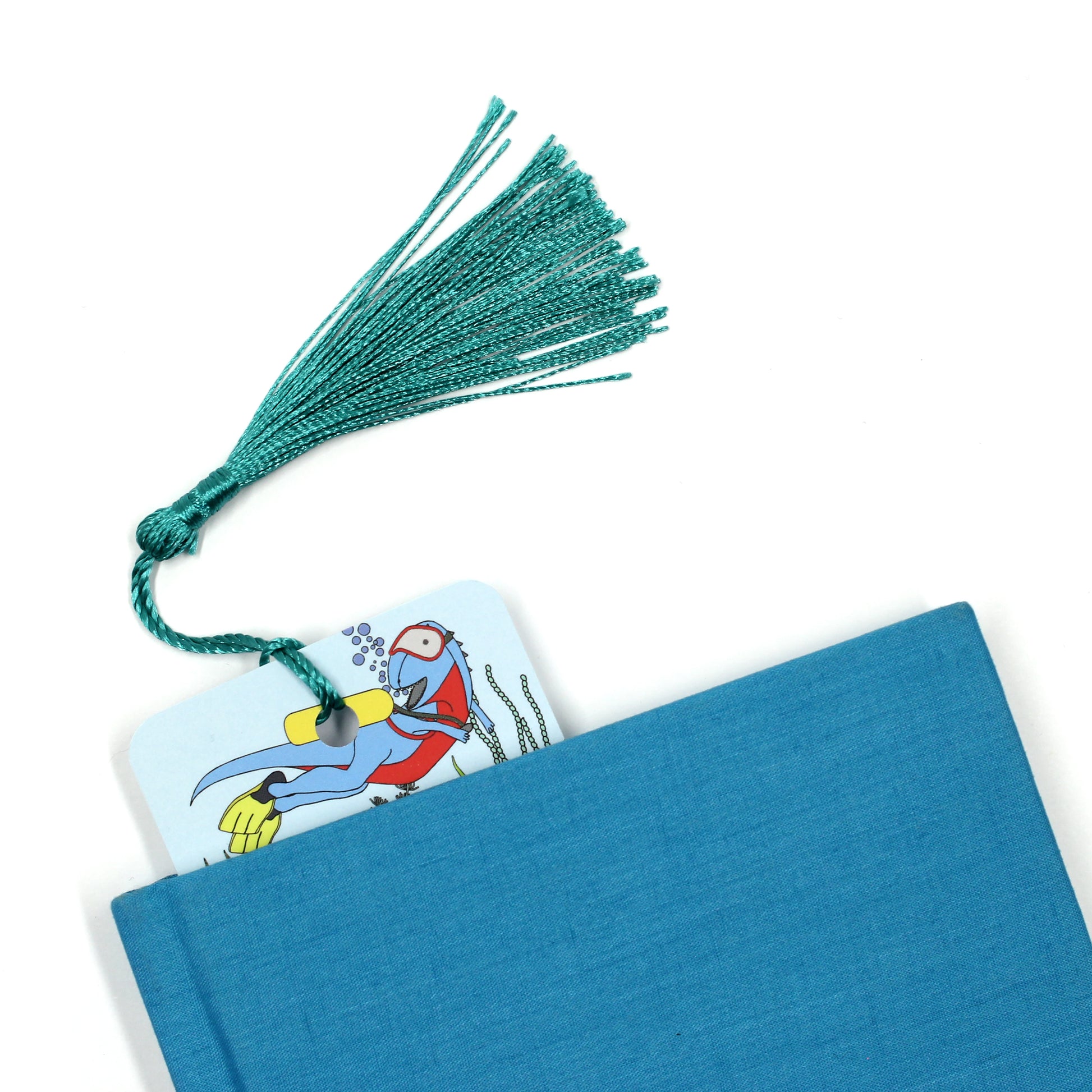 under the sea dinosaur bookmark with tassel coming out of blue book