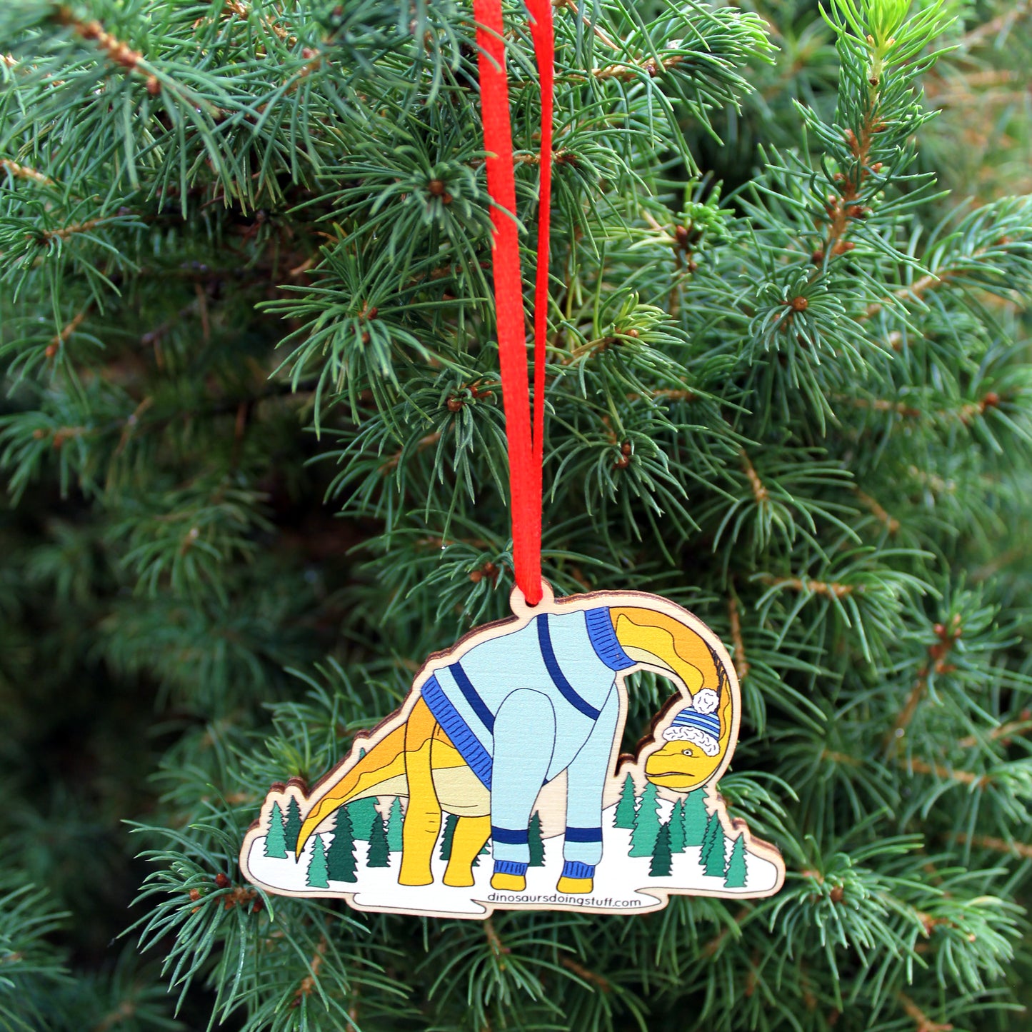 wooden ugly Christmas jumper decoration hanging on a Christmas tree