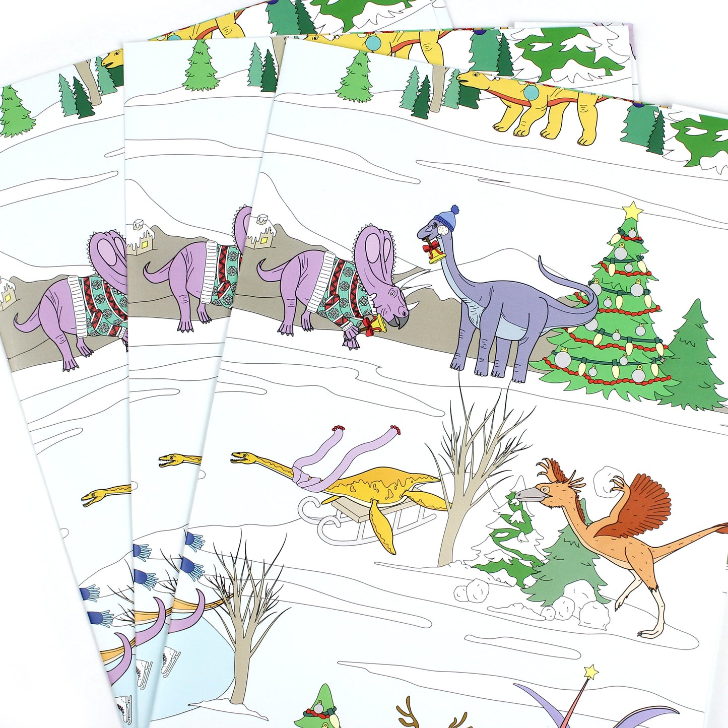 3 sheets of Dinosaur Christmas Winter Scene Wrapping Paper fanned out