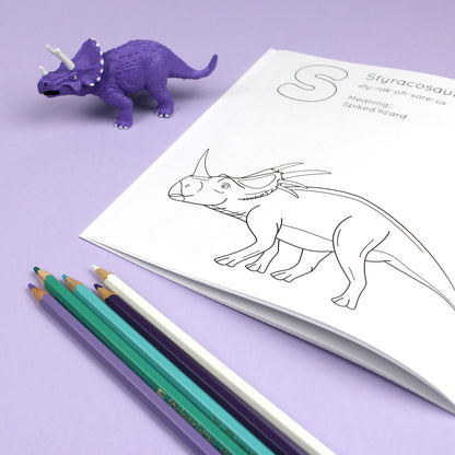 Inside page of ABC Dinosaur colouring book. The page features black line illustration of a Styracosaurus dinosaur with its name, pronunciation and meaning above it.