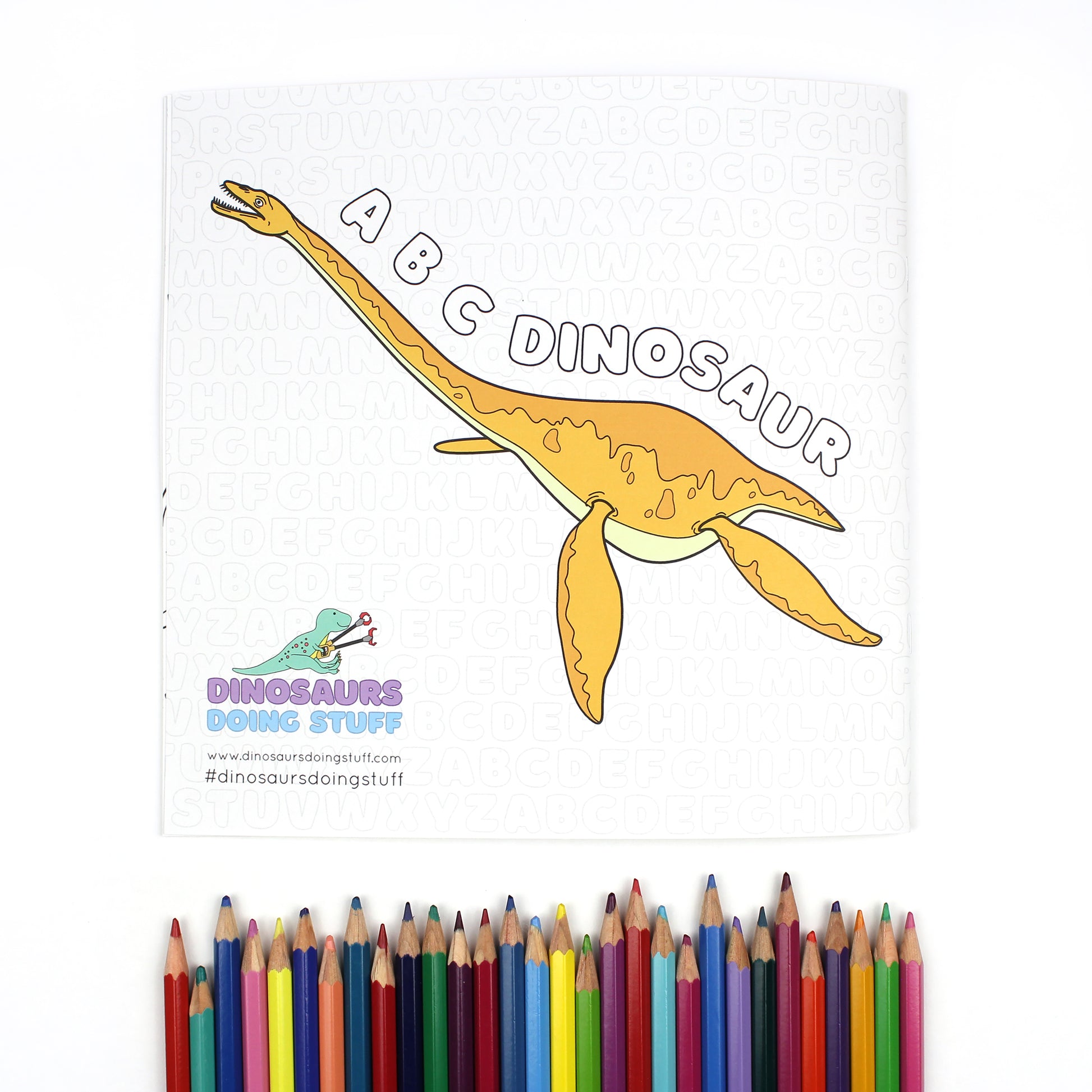 The back cover of ABC Dinosaur Colouring Book. There is also a row of brightly coloured pencils below.