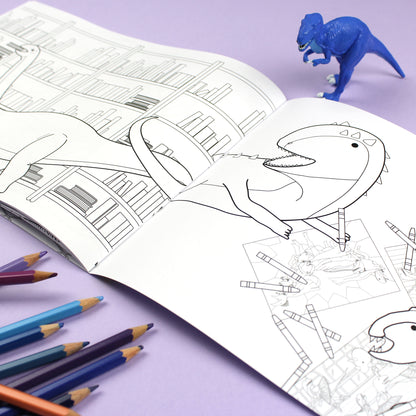 Inside page of Dinosaurs Doing Stuff colouring book. The page features black line illustrations of a dinosaur colouring in pages from the colouring book.
