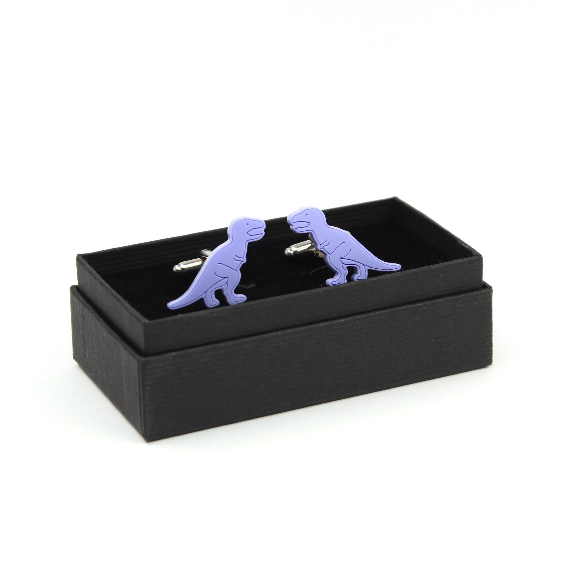 pair of blue tyrannosaurus-rex dinosaur cufflinks in a black cufflink box