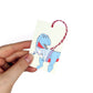 hand holding a ugly Christmas jumper dinosaur gift tag