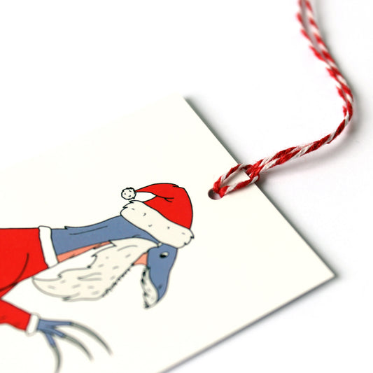 dinosaur Santa Claws gift tag close up
