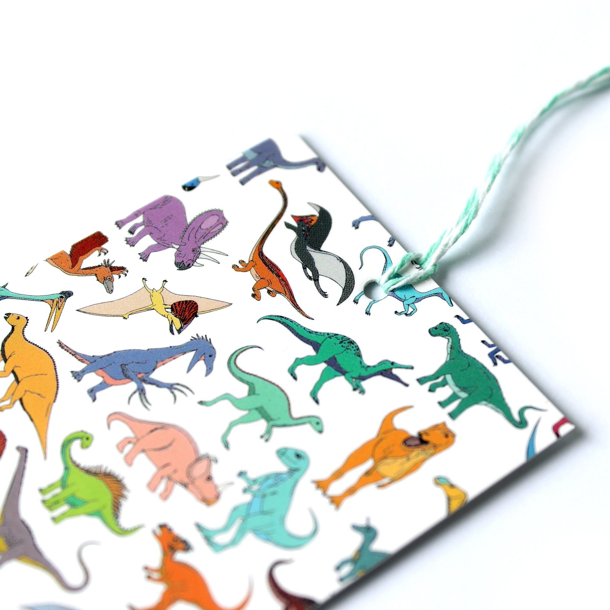 scattered dinosaur gift tag close up