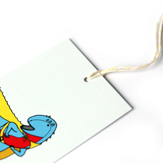 Superhero dinosaur gift tag close up