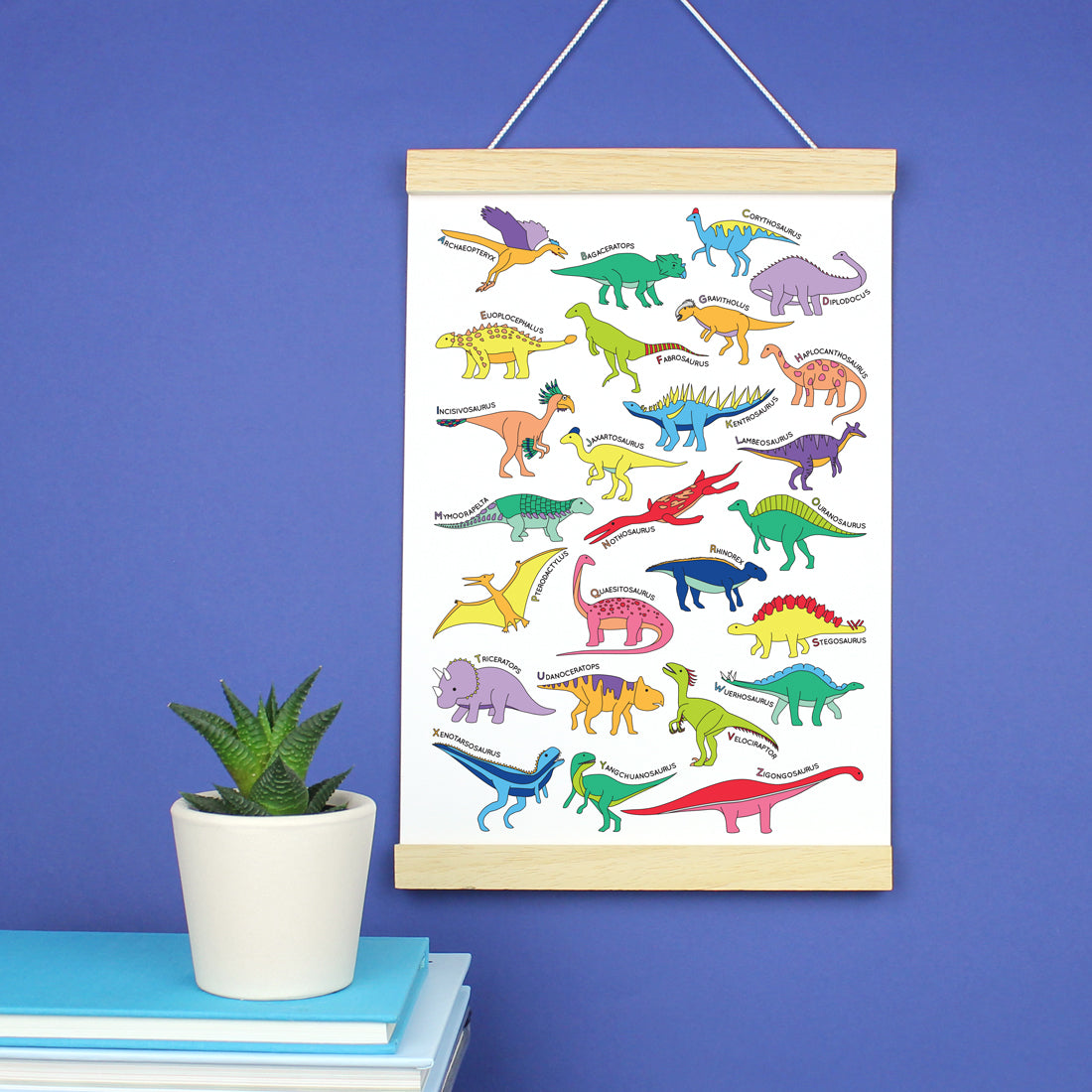 Dinosaur Alphabet Poster Print in a wooden strip frame
