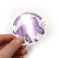 Titanoceratops dinosaur sticker held by a hand