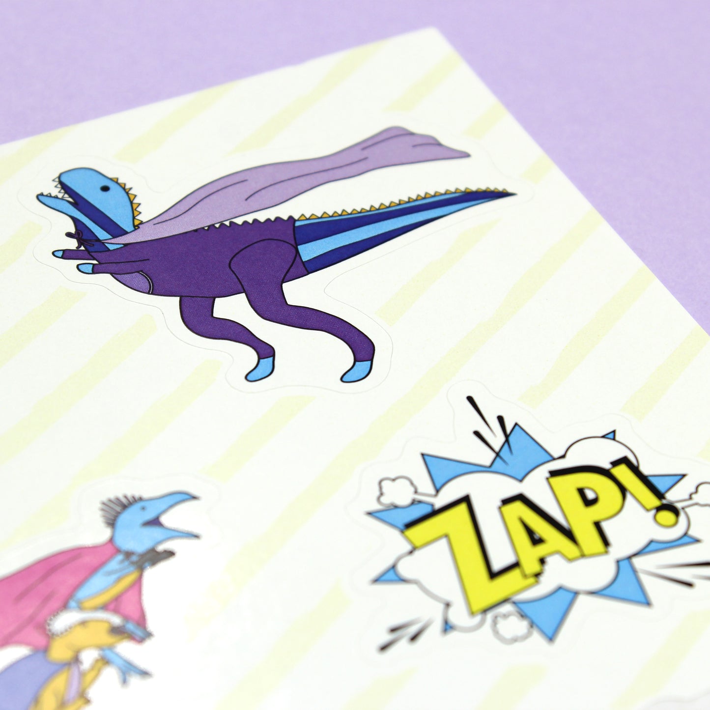 dinosaur superhero sticker sheet close up