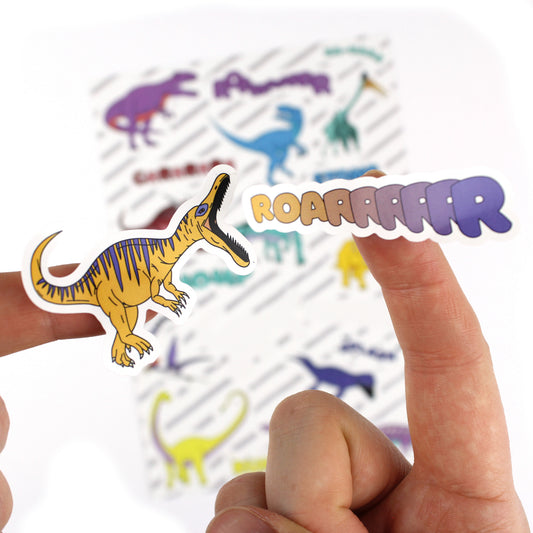 close up of dinosaur words sticker with sheet in the background