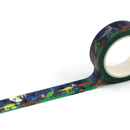 A roll of Halloween dinosaur washi tape rolled out showing the full design