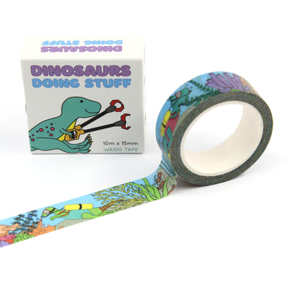 A roll of under the sea dinosaur washi tape with a box of washi tape behind it