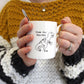Time for Tea-Rex Mug being held by a person in a mustard, white and grey chunky knit jumper