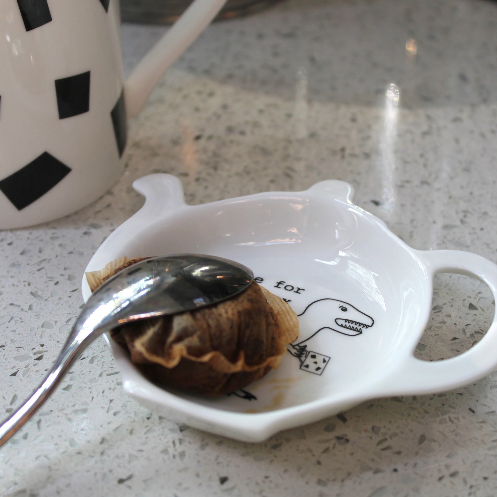 Time for Tea-Rex Teabag Tidy with a teabag and spoon resting on it